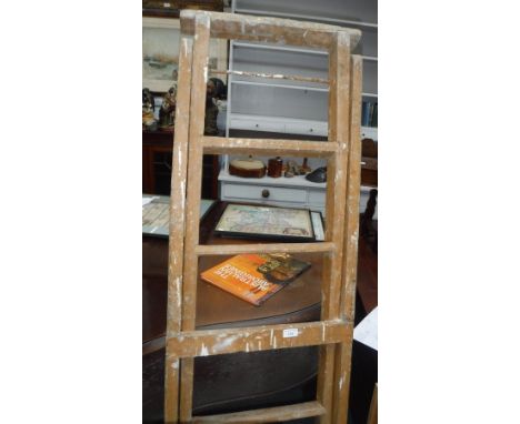 A SET OF VINTAGE DECORATOR'S STEPS, 67" high