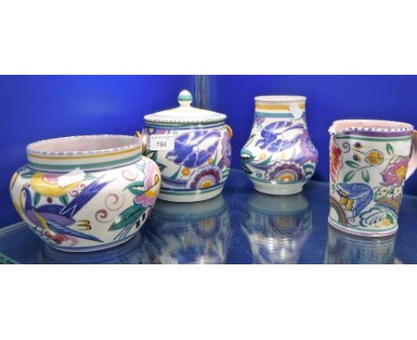 A 1920'S/30'S POOLE POTTERY BISCUIT JAR and three other similar pieces (4)