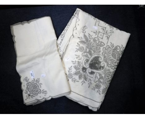 A VINTAGE TABLE CLOTH AND NAPKIN LINEN SET, embroidered with flowers