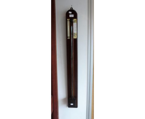 A STICK BAROMETER on an oak board, 39" high