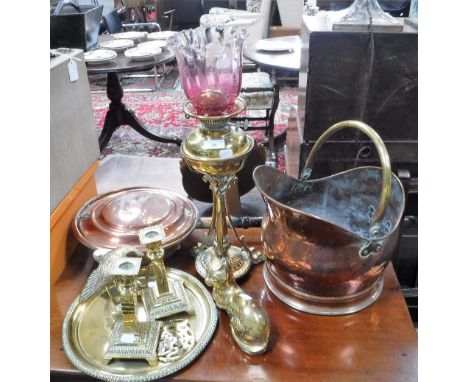 A VICTORIAN BRASS OIL LAMP with a smaller cranberry glass shade and a collection of similar brassware