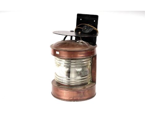 A copper ships lantern, with a black painted wall mount, later wired for electricity, 45.5cms high overall.
