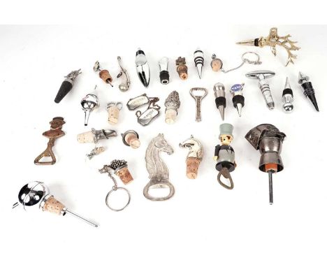 A selection of bottle stoppers and openers, including: a brass stags head bottle topper; an equestrian horse head cork bottle