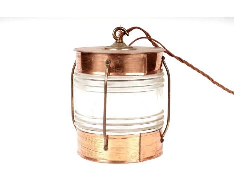 A copper and brass ships lantern, converted to a ceiling or hanging light, wired for electricity, 25cms high.