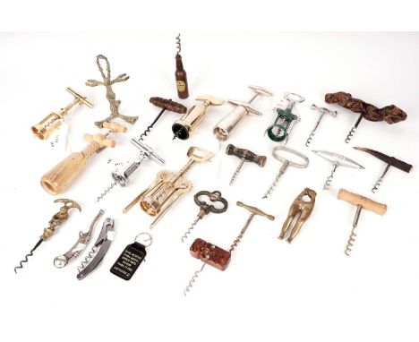 A selection of corkscrews and bottle openers, including: a Guiness corkscrew; various brass corkscrews; a horn handled corksc