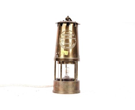 A brass miners safety lamp, by Eccles The Protector Lamp &amp; Lighting, converted to electricity, 32cms high (including hand