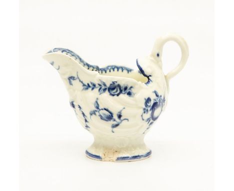 A Worcester Dolphin Ewer, circa 1770, of shell-moulded form and painted in blue with fruits and flowers, 6.5cm high. (chip to