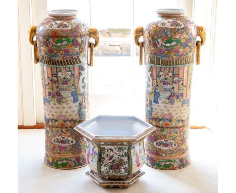 A pair of Chinese Canton famille rose style floor vases, modern, of ovoid form with twin ring handles, decorated with typical