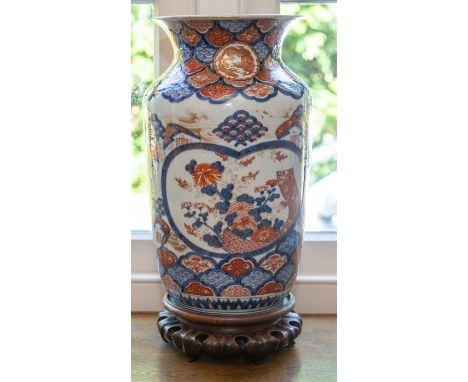 A Japanese Imari vase, late Edo period, of ovoid form with everted rim, painted in underglaze blue and enamel colours and gil