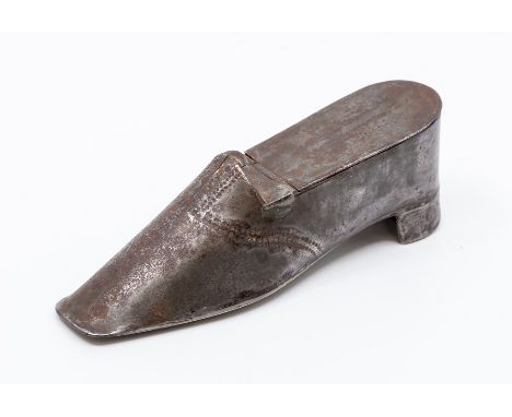 A 19th Century pewter snuff box, modelled as a shoe with punched stitching detail, 12.5cm long.