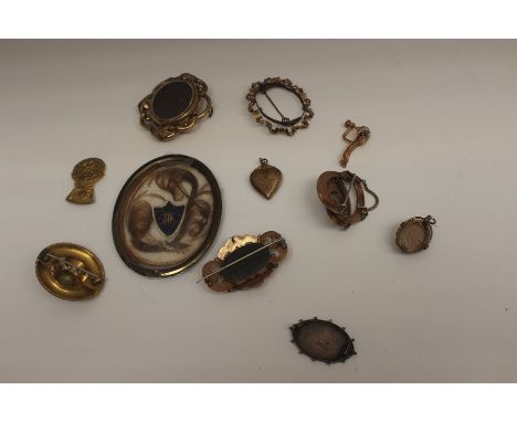 A collection of assorted Victorian gilt metal and yellow metal brooches, mostly of Rococo design, one set with small turquois