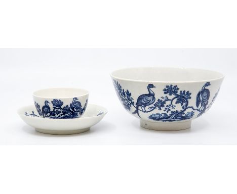 A Worcester teabowl and saucer, circa 1770-90, printed in blue with the 'Birds in Branches' pattern, saucer 12cm dia., togeth