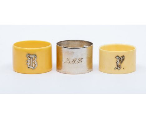 A George V silver napkin ring, maker RR, Sheffield 1921, engraved with initials 'MSH', weight 1.4oz, tiogether with two ivori