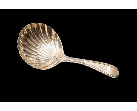 A George III silver caddy spoon, George Smith, London 1782, the bowl of scallop shell form on a beaded handle, 8cm, weight 0.