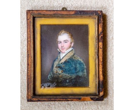 An English school portrait miniature of a gentleman, painted on ivory, the sitter a young man with blond hair wearing a dark 