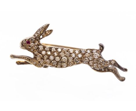 A diamond brooch, depicting a running hare, the body pave set with brilliant cut diamonds, ruby set eyes, unmarked possibly s