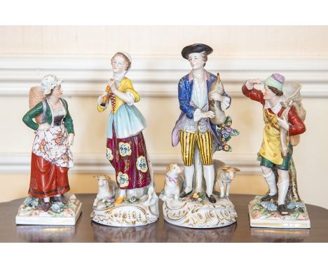 Two pairs of German porcelain figures, circa 1900, the first Sitzendorf and modelled as a shepherd and shepherdess playing pi