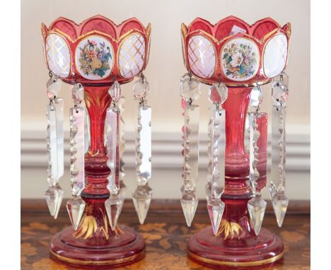 &nbsp;A pair of Bohemian ruby and white overlay glass lustres,&nbsp;circa 1890, of typical form, the rims overlaid with white