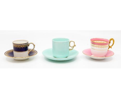 A Royal Worcester coffee can and saucer, dated 1922, decorated with a dark blue, gilt and jewelled border, together with a Ro