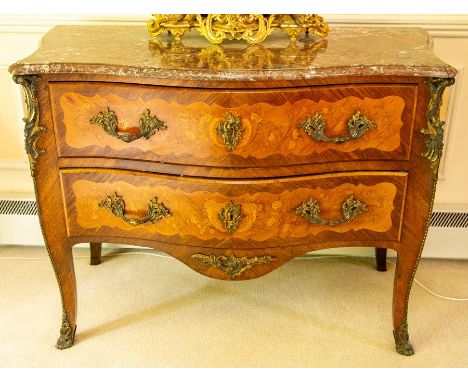 A French Louis XV style Kingwood marquetry and gilt metal mounted marble-topped bombe commode, circa 1880-90, the moulded pin