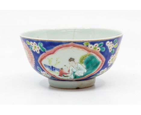 A Chinese Nyonya-type porcelain erotic bowl, of rounded form, the inside painted in colours with a scene of a nude couple in 