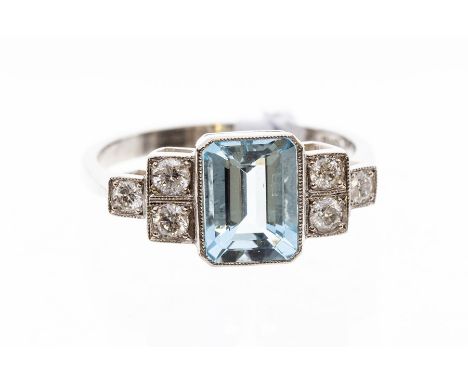 An aquamarine and diamond dress ring, the octagonal aquamarine weighing approx. 50ct, grain set diamond stepped shoulders, se