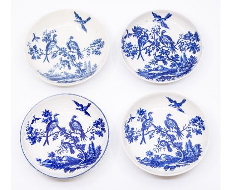Four Worcester tea saucers, circa 1770-90, all decorated with the 'Birds in Branches' pattern, one with a blue lined rim, 12c