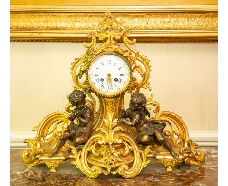 A French ormolu figural mantel clock, circa 1890, the barrel case with 4 inch enamelled dial having black Arabic and Roman nu