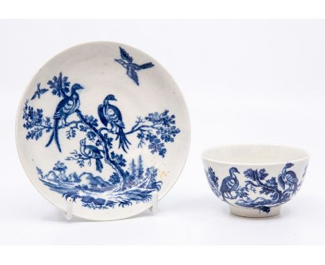 A Worcester teabowl and saucer, circa 1770-90, printed in blue with the 'Birds in Branches' pattern, saucer 12cm dia. (2)