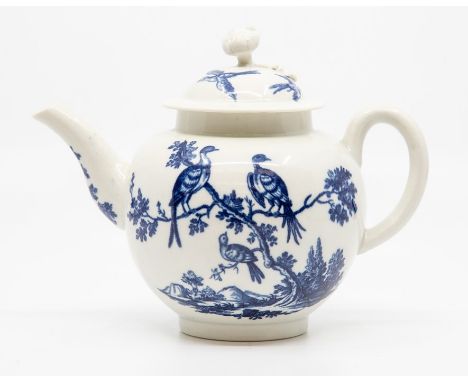 A Worcester teapot and cover, circa 1770-90, of globe form with ribbed loop handle and flower finial, printed in blue with th