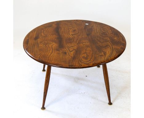 An Ercol dark elm circular coffee table, W74cm, H43cm 