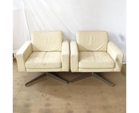 A pair of mid-century style Danish swivel leather lounge chairs by Bolia, model Pasadena, designed by Glismand &amp; Rudiger,