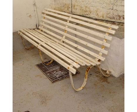 A scrolled wrought-iron slatted and painted garden bench, L182cm 