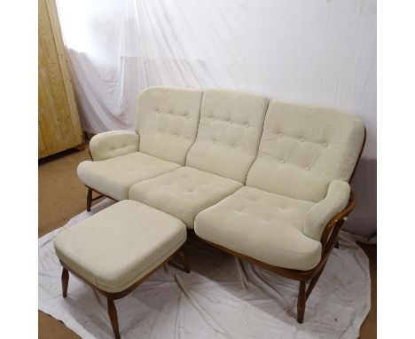 An Ercol 3-piece suite, comprising a 3-seater settee and a pair of matching armchairs 