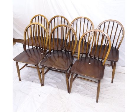 A set of 7 Ercol elm-seated CC41 stick-back dining chairs 