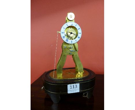 A 19th Century French exhibition skeleton alarm clock, the enamelled dial signed Pierret, Paris