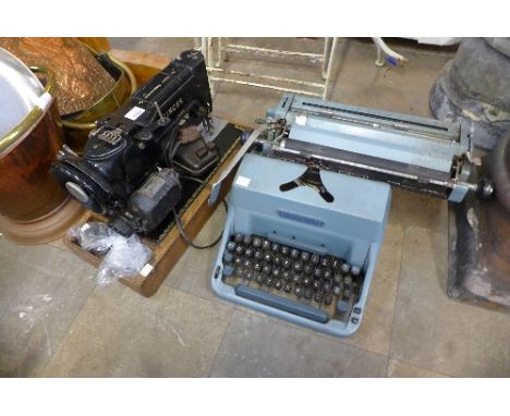 A vintage Imperial typewriter and a Singer sewing machine
