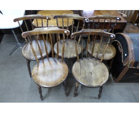 A set of five Victorian beech stick back kitchen chairs