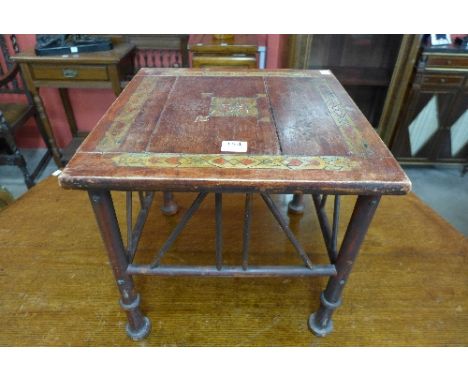 An Arts and Crafts stool in the manner of Liberty & Co.