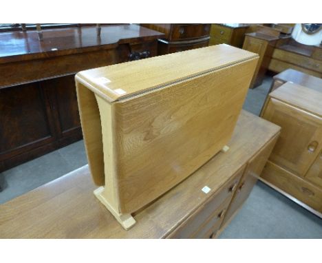 A small Ercol drop-leaf table