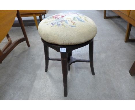 A Victorian mahogany revolving piano stool
