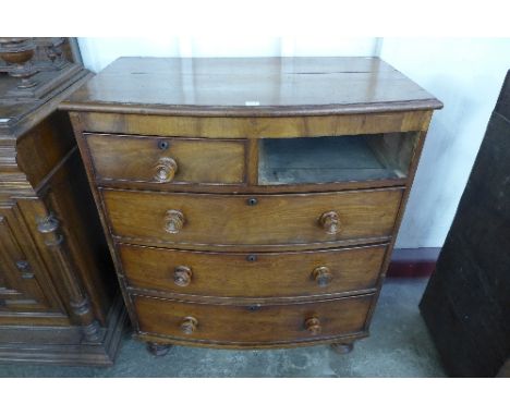 A Victorian walnut bow front chest of drawers (missing drawer)