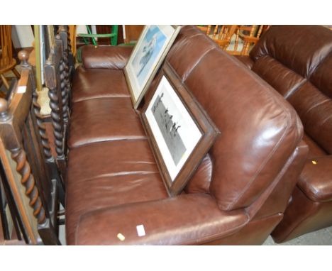 A brown leather three seater sofa 