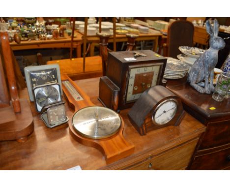 A Smiths two hole mentel clock together with a modern barometer; various other clocks and candelabra