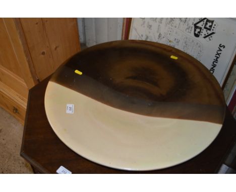 A large modern ceramic charger