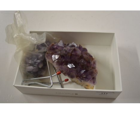A large piece of amethyst quartz; and a bag of polished amethyst stones 