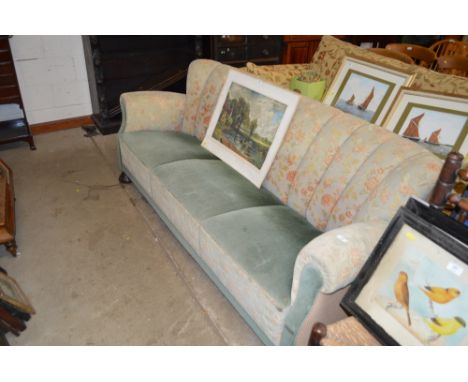 A 1930's three seater sofa with floral upholstery 