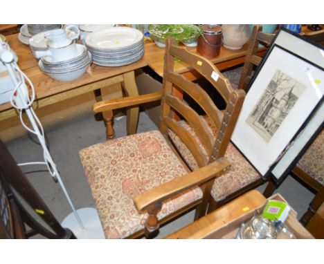 A set of six oak ladder back dining chairs to include two carvers 