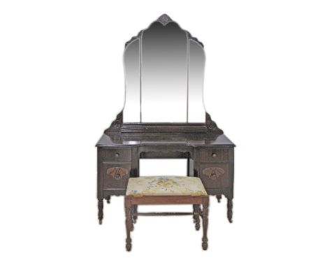 Carved walnut dressing table with mirror on turned legs with castors. W107cm, D46cm, H173cm together with a stool with openin