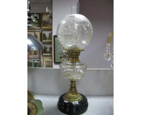 A Late XIX Century Oil Lamp, with glass funnel, engraved glass shade, well, brass pedestal, stepped base.